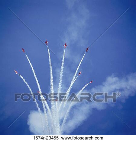 Low angle view of fighter planes performing aerobatics in sky, Red Arrows, Royal Air Force, England View Large Photo Image Stock Photography - Low angle view of fighter planes performing aerobatics in sky, Red Arrows, Royal Air Force, England. Fotosearch