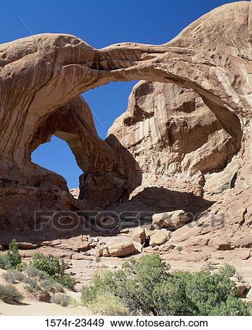 Low angle view of natural arches, Double Arch, Arches National Park, Utah, USA View Large Photo Image Stock Photo - Low angle view of natural arches, Double Arch, Arches National Park, Utah, USA. Fotosearch
