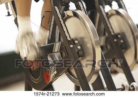 Low section view of a person on an exercise bike View Large Photo Image Stock Image - Low section view of a person on an exercise bike. Fotosearch