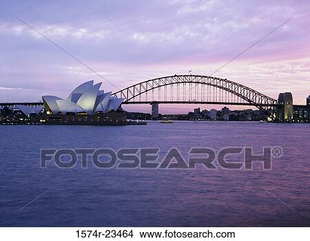 Opera house with a bridge on the waterfront, Sydney Opera House, Sydney Harbor Bridge, Sydney, New South Wales, Australia View Large Photo Image Picture - Opera house with a bridge on the waterfront, Sydney Opera House, Sydney Harbor Bridge, Sydney, New South Wales, Australia. Fotosearch