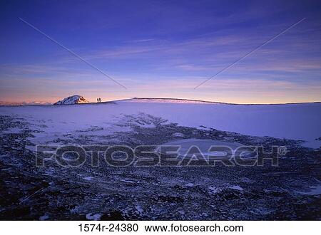 Stock Image - Panoramic view of a polar landscape at dusk, Hellisheidi, Iceland. Fotosearch