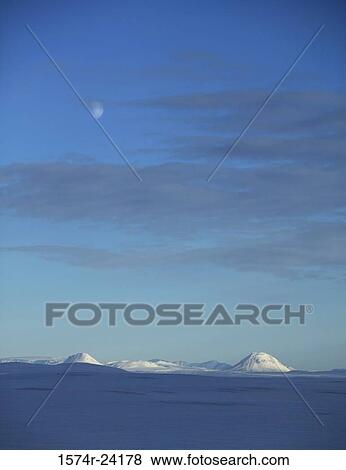 Panoramic view of a snow covered landscape with mountains in the background, Mount Nyrdri Haganga, Mount Sydri Haganga, Iceland View Large Photo Image Stock Photo - Panoramic view of a snow covered landscape with mountains in the background, Mount Nyrdri Haganga, Mount Sydri Haganga, Iceland. Fotosearch