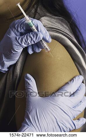Person getting an injection View Large Photo Image Stock Image - Person getting an injection. Fotosearch