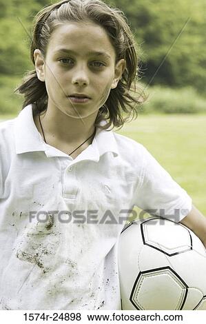 Portrait of a boy holding a soccer ball View Large Photo Image Stock Photo - Portrait of a boy holding a soccer ball. Fotosearch