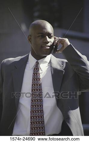 Stock Image - Portrait of a businessman talking on a mobile phone. Fotosearch