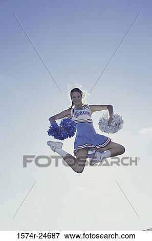 Portrait of a cheerleader jumping View Large Photo Image Stock Photo - Portrait of a cheerleader jumping. Fotosearch