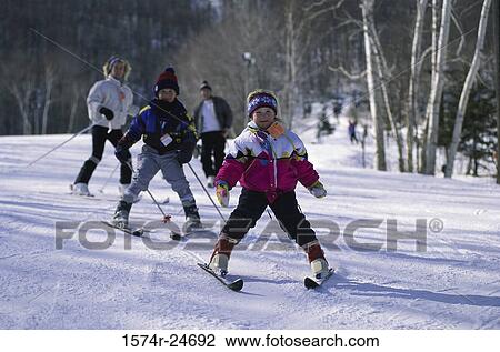 Portrait of a children and their parents skiing View Large Photo Image Stock Image - Portrait of a children and their parents skiing. Fotosearch