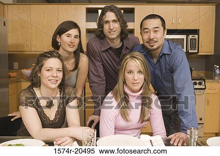 Portrait of two young men with three young women at a dining table View Large Photo Image Stock Photography - Portrait of two young men with three young women at a dining table. Fotosearch