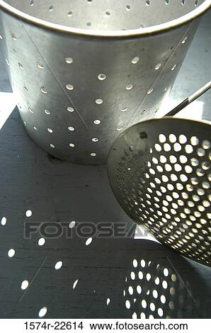 Picture - Potato masher and a colander. Fotosearch