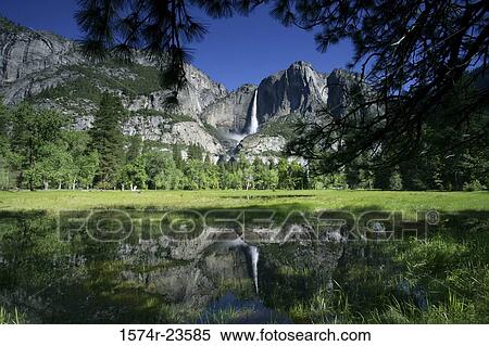 Reflection of mountains and waterfall in a river, Upper Yosemite Falls, Yosemite National Park, California, USA View Large Photo Image Stock Photography - Reflection of mountains and waterfall in a river, Upper Yosemite Falls, Yosemite National Park, California, USA. Fotosearch