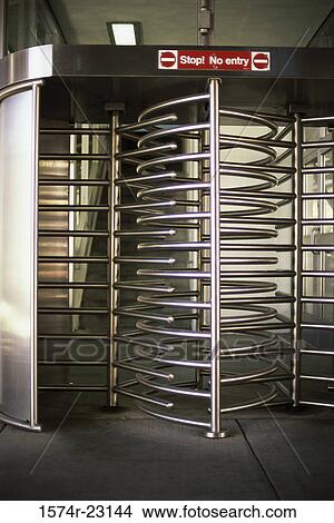Picture - Revolving door at the subway station. Fotosearch