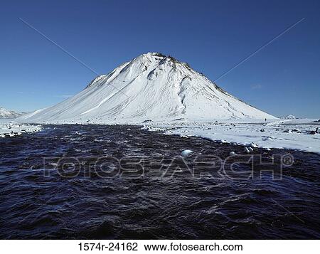 River flowing through a snow covered landscape near a mountain, Brennivinskvisl River, Mount Maelifell, Iceland View Large Photo Image Stock Image - River flowing through a snow covered landscape near a mountain, Brennivinskvisl River, Mount Maelifell, Iceland. Fotosearch