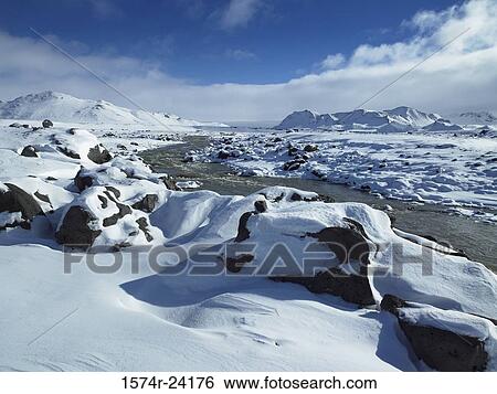 River flowing through a snow covered landscape, Emstrur River, Iceland View Large Photo Image Stock Photograph - River flowing through a snow covered landscape, Emstrur River, Iceland. Fotosearch