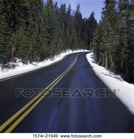 Road passing through a countryside, Wyoming, USA View Large Photo Image Stock Photo - Road passing through a countryside, Wyoming, USA. Fotosearch