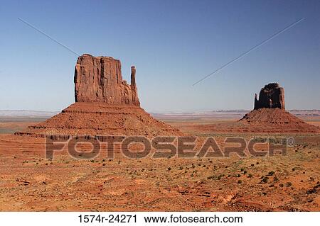 Rock formations on an arid landscape, East Mitten and Merrick Buttes, Monument Valley, Arizona, USA View Large Photo Image Stock Image - Rock formations on an arid landscape, East Mitten and Merrick Buttes, Monument Valley, Arizona, USA. Fotosearch