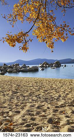 Stock Image - Rocks in a lake, Lake Tahoe, Nevada, USA. Fotosearch