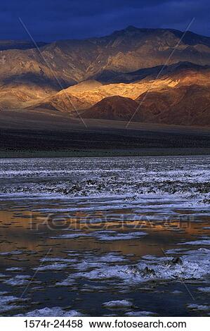 Salt flat in front of mountains, Devil's Golf Course, Death Valley National Park, California, USA View Large Photo Image Stock Photo - Salt flat in front of mountains, Devil's Golf Course, Death Valley National Park, California, USA. Fotosearch