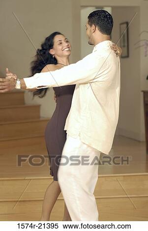 Side profile of a young couple dancing the tango View Large Photo Image Stock Photography - Side profile of a young couple dancing the tango. Fotosearch
