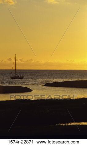 Silhouette of a boat in the sea during sunset, Waimea Bay, Oahu, Hawaii, USA View Large Photo Image Stock Image - Silhouette of a boat in the sea during sunset, Waimea Bay, Oahu, Hawaii, USA. Fotosearch