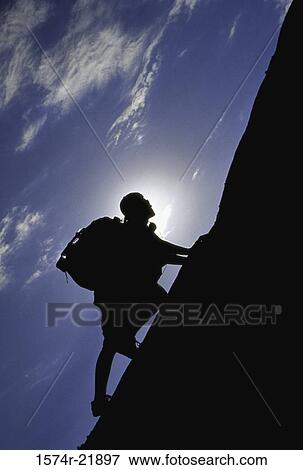 Silhouette of a person climbing, Devils Punch Bowl, California, USA View Large Photo Image Stock Photo - Silhouette of a person climbing, Devils Punch Bowl, California, USA. Fotosearch