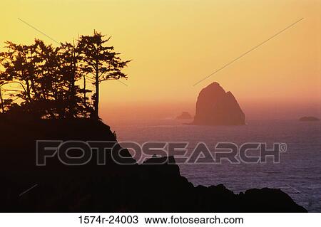 Silhouette of a rock formation in the sea, Haystack Rock, Boardman State Park, Oregon, USA View Large Photo Image Stock Image - Silhouette of a rock formation in the sea, Haystack Rock, Boardman State Park, Oregon, USA. Fotosearch