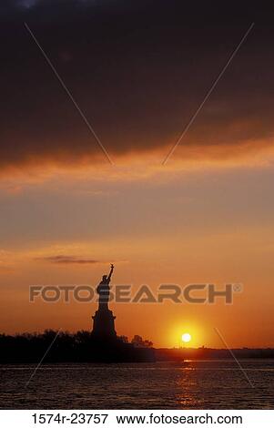 Silhouette of a statue at sunset, Statue of Liberty, New York City, New York, USA View Large Photo Image Stock Photo - Silhouette of a statue at sunset, Statue of Liberty, New York City, New York, USA. Fotosearch