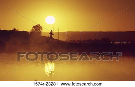 Silhouette of a woman running View Large Photo Image Stock Image - Silhouette of a woman running. Fotosearch