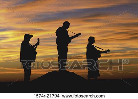 Silhouette of three people playing guitars, Boulder, Colorado, USA View Large Photo Image Picture - Silhouette of three people playing guitars, Boulder, Colorado, USA. Fotosearch