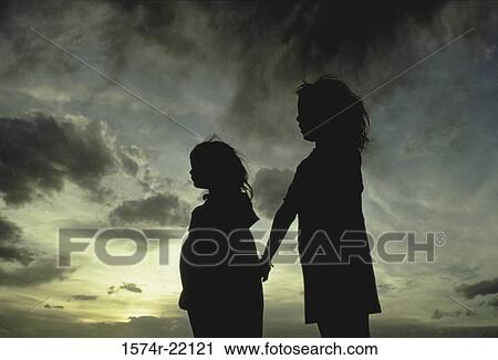 Silhouette of two girls holding hands View Large Photo Image Stock Image - Silhouette of two girls holding hands. Fotosearch