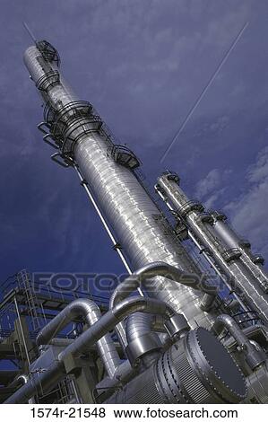 Smokestacks at an oil refinery View Large Photo Image Stock Photo - Smokestacks at an oil refinery. Fotosearch
