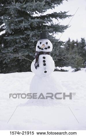 Snowman on a hill View Large Photo Image Stock Photography - Snowman on a hill. Fotosearch