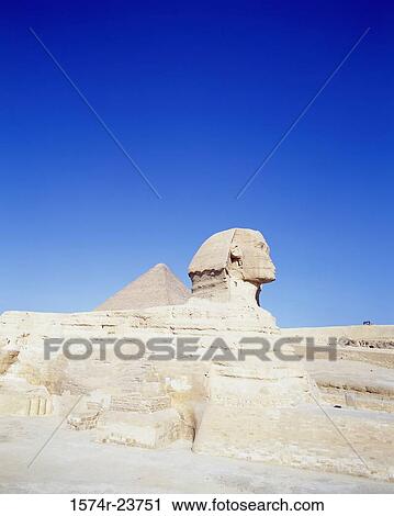 Stock Image - Sphinx near a pyramid, Great Sphinx, Giza, Egypt. Fotosearch
