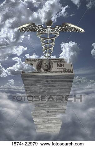 Stack of American dollar bills and a caduceus View Large Photo Image Stock Photo - Stack of American dollar bills and a caduceus. Fotosearch