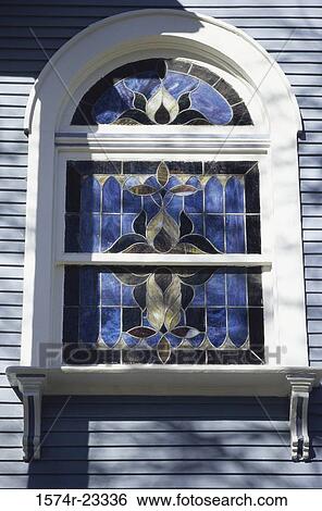 Stained glass window on a building View Large Photo Image Stock Photograph - Stained glass window on a building. Fotosearch
