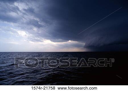 Storm clouds over the ocean View Large Photo Image Stock Photo - Storm clouds over the ocean. Fotosearch