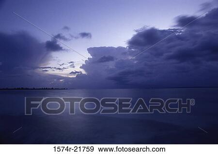 Storm clouds over the ocean View Large Photo Image Stock Photo - Storm clouds over the ocean. Fotosearch
