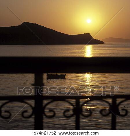 Stock Image - Sunrise over the ocean, Greece. Fotosearch