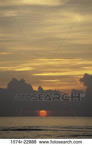 Sunset over the ocean, Bali, Indonesia View Large Photo Image Stock Photo - Sunset over the ocean, Bali, Indonesia. Fotosearch