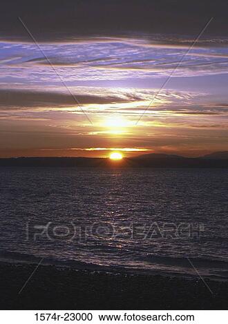 Sunset over the ocean, Carkeek Park, Seattle, Washington, USA View Large Photo Image Stock Image - Sunset over the ocean, Carkeek Park, Seattle, Washington, USA. Fotosearch
