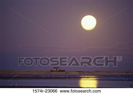 Stock Photograph - Sunset over the ocean, Chatham, Massachusetts, USA. Fotosearch
