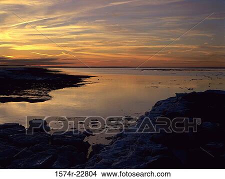 Picture - Sunset over the ocean. Fotosearch