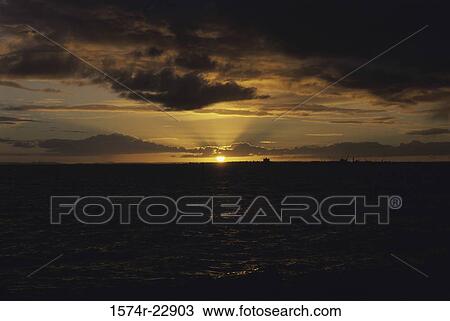 Stock Image - Sunset over the ocean, St. Kilde, Melbourne, Australia. Fotosearch