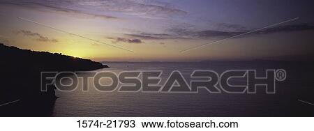 Sunset over the ocean View Large Photo Image Stock Image - Sunset over the ocean. Fotosearch