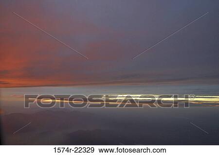 Stock Photo - Sunset over the ocean. Fotosearch