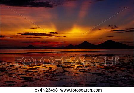 Sunset over the sea, Kimbe Bay, Papua New Guinea View Large Photo Image Stock Photo - Sunset over the sea, Kimbe Bay, Papua New Guinea. Fotosearch