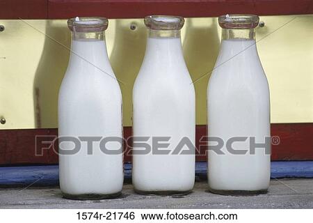 Three bottles of milk View Large Photo Image Stock Photograph - Three bottles of milk. Fotosearch