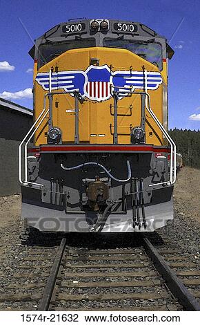 Stock Image - Train on railway tracks. Fotosearch