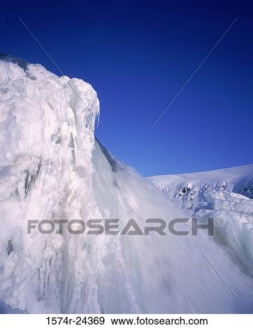 Water falling from a snow covered cliff, Gullfoss Falls, Iceland View Large Photo Image Stock Photo - Water falling from a snow covered cliff, Gullfoss Falls, Iceland. Fotosearch