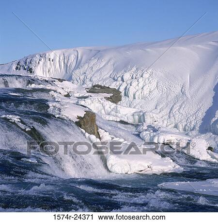 Water flowing through a snow covered landscape, Gullfoss Falls, Iceland View Large Photo Image Stock Image - Water flowing through a snow covered landscape, Gullfoss Falls, Iceland. Fotosearch