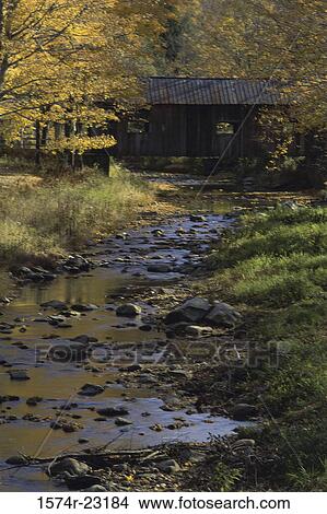 Water flowing under a covered bridge, Grafton, Vermont, USA View Large Photo Image Picture - Water flowing under a covered bridge, Grafton, Vermont, USA. Fotosearch